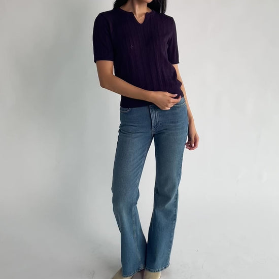 Perry Knit Top in Plum with pointelle texture, notched crew neckline, short sleeves, and ribbed hem and cuffs.