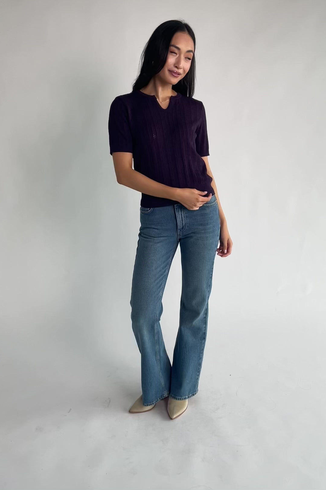 Perry Knit Top in Plum with pointelle texture, notched crew neckline, short sleeves, and ribbed hem and cuffs.