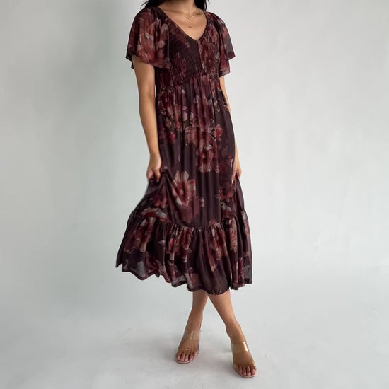 Livia Mesh Midi Dress in Brown + Rust Floral with V-neckline, smocked bodice, flutter sleeves, and tiered hem.