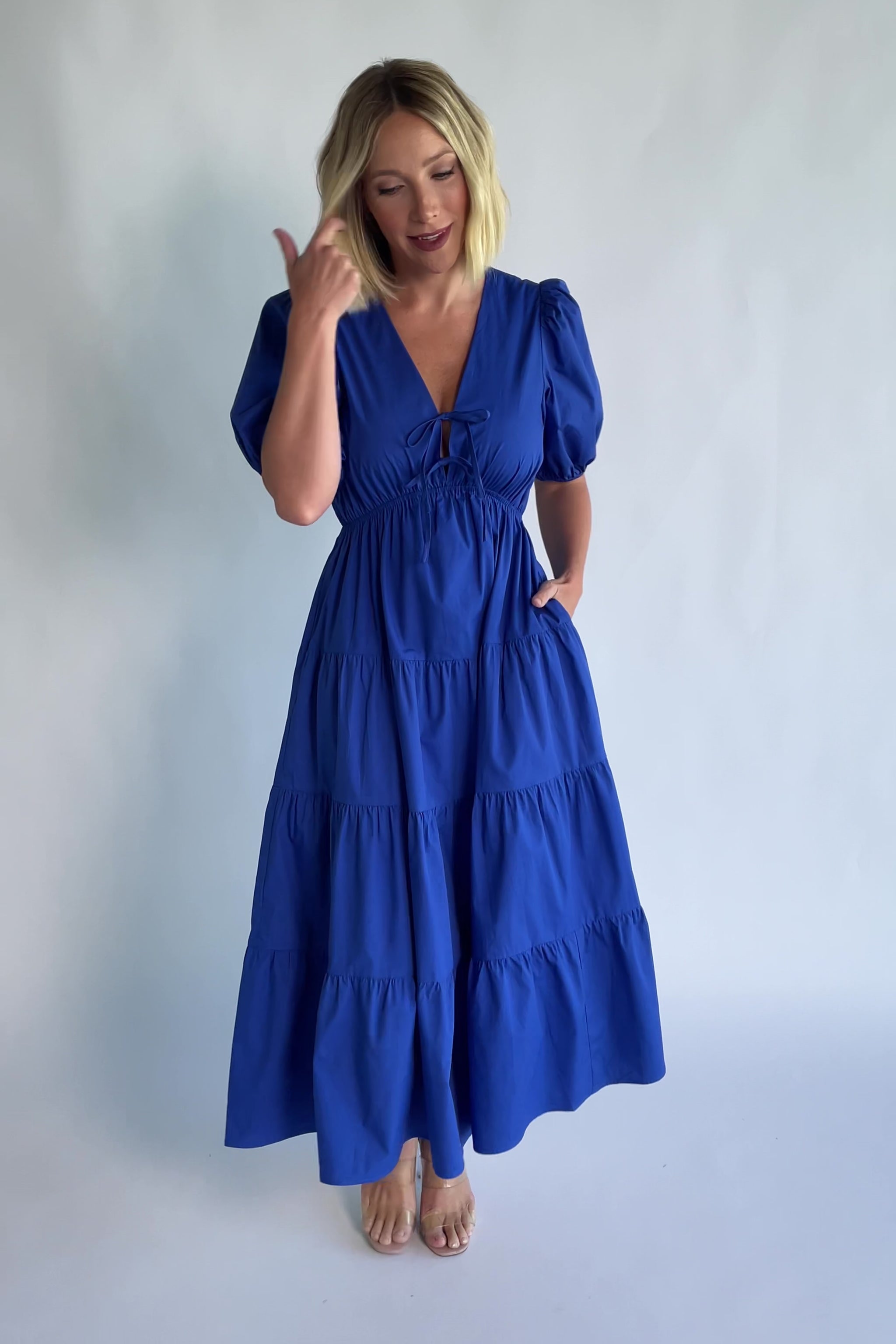Sheila Tiered Midi Dress in Cobalt with V-neckline, front ties, puff sleeves, smocked empire waist, and tiered skirt.