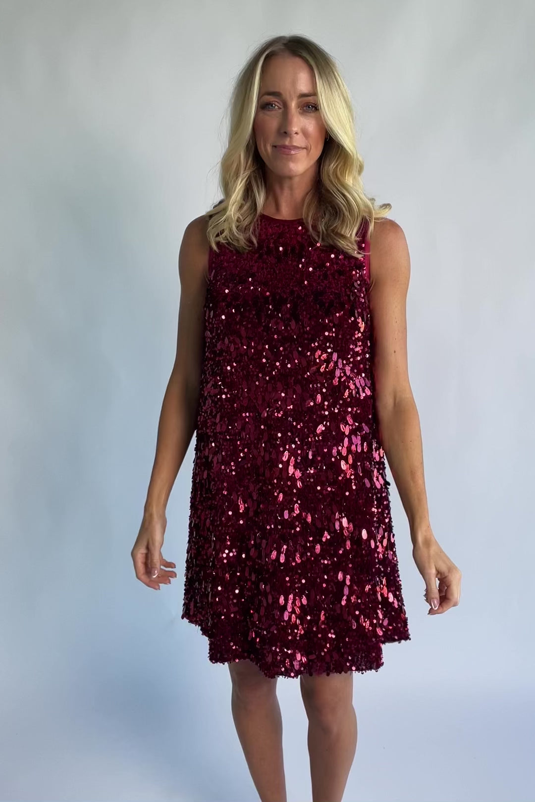 Jolene Sequin Short Dress in Wine with allover sequin detailing, a sleeveless silhouette, and a round neckline.