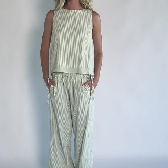 Sage striped matching set with a sleeveless open-back tie top, wide-leg pants, smocked waistband, side pockets, and a relaxed fit.