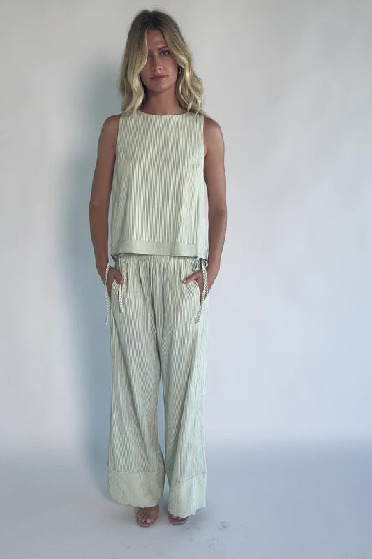Sage striped matching set with a sleeveless open-back tie top, wide-leg pants, smocked waistband, side pockets, and a relaxed fit.