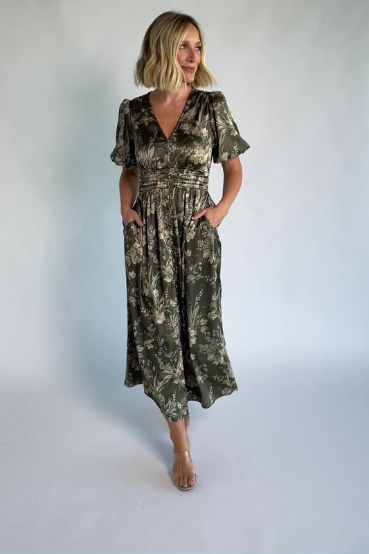 Lilibet Satin Dress in Olive Floral with V-neckline, short sleeves, faux front buttons, gathered waist, and satin finish.
