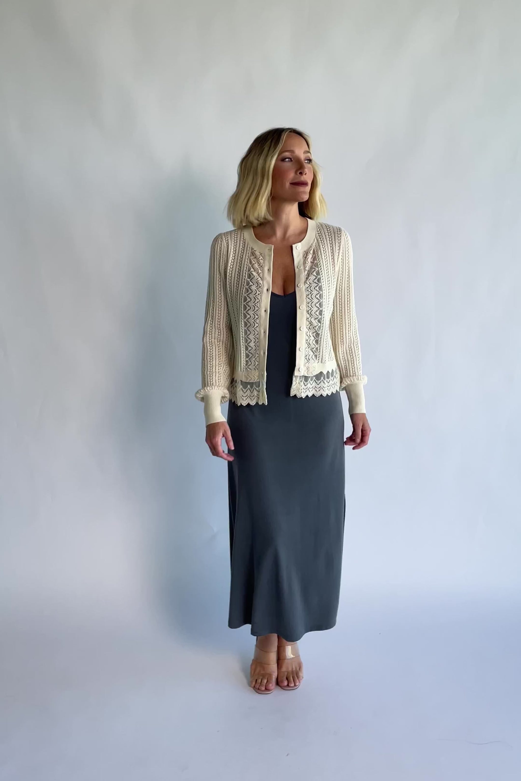 Bethany Pointelle Cardigan in Cream with pointelle knit detailing, a button-front design, and scalloped trim.