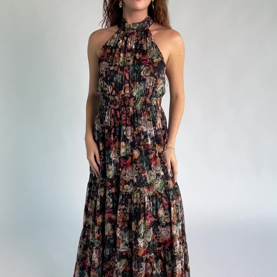Pulitzer Maxi Dress in Black Multi Floral with halter neckline, smocked waist, tie-back detail, and tiered chiffon skirt.