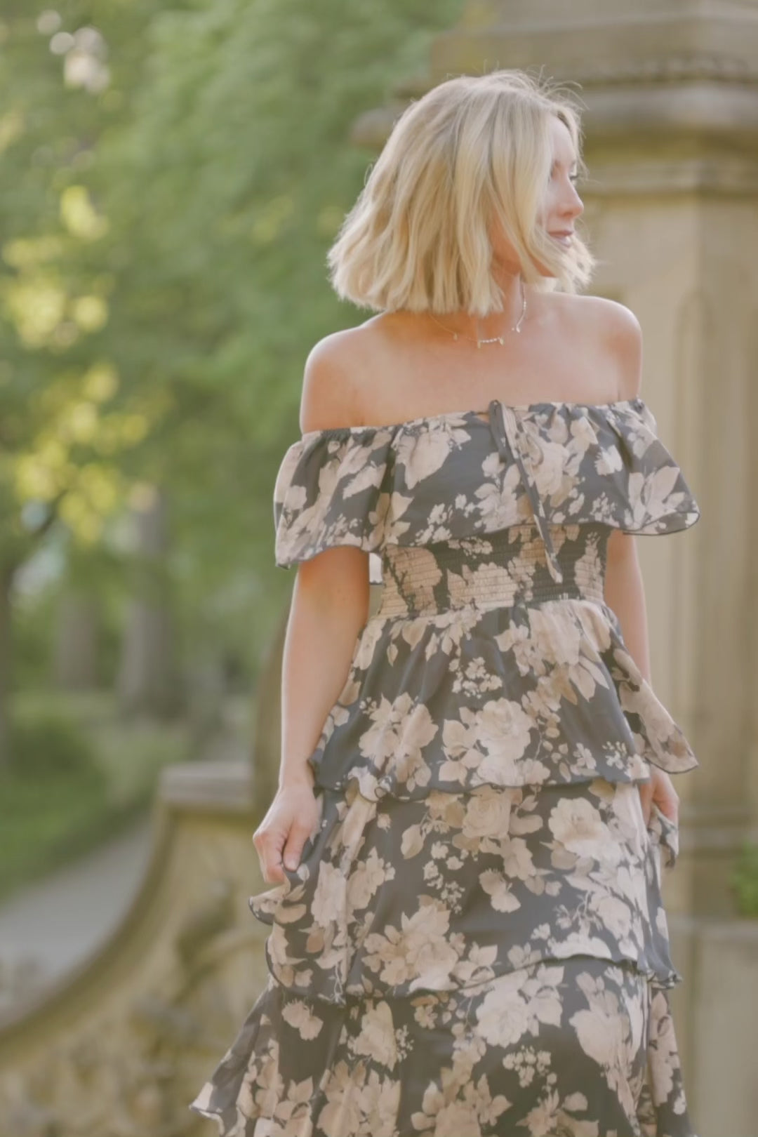 Isabelle Off Shoulder Maxi Dress in Multi Floral with elastic neckline, ruffle bust, smocked waist, and four-tiered skirt.