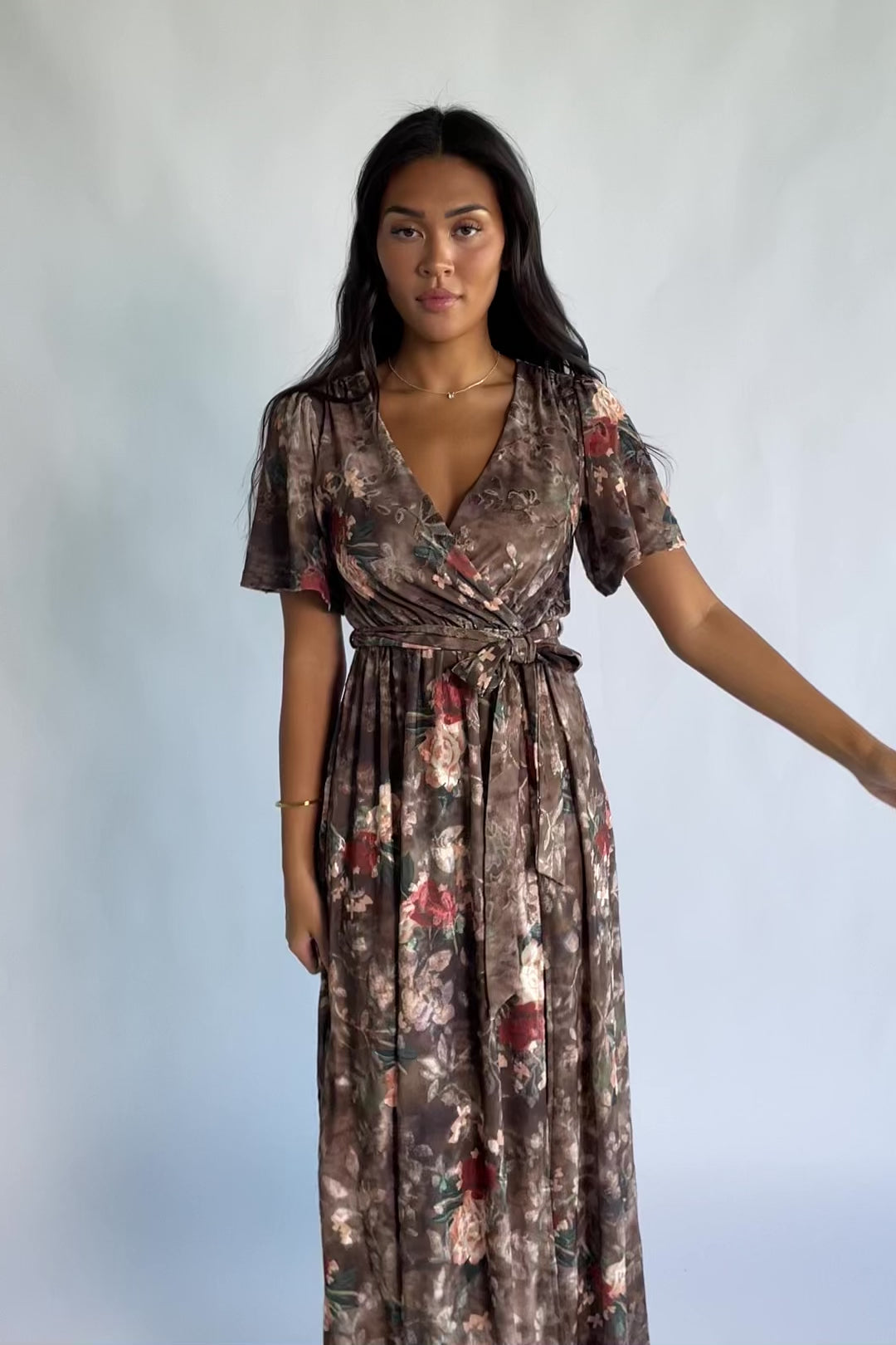Uma Velvet Maxi Dress in Brown Floral with a burnout mesh overlay, crossover V-neckline, and a side leg slit.