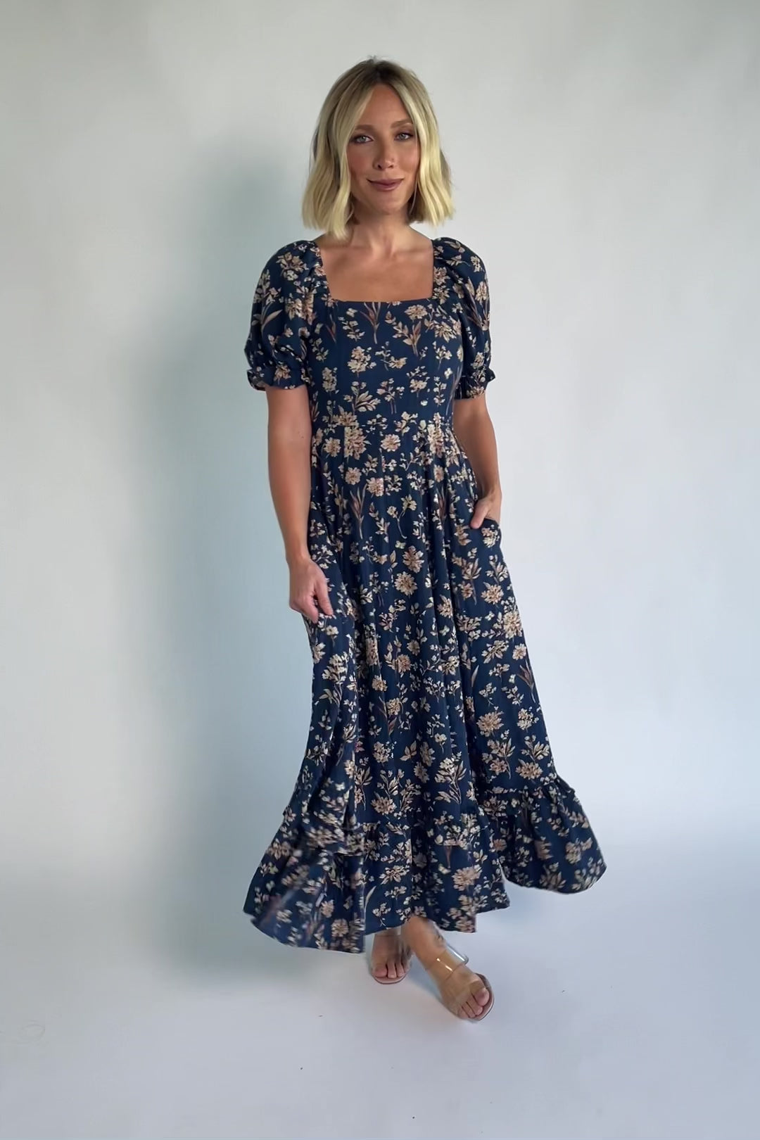 Addison Maxi Dress in Dark Blue Floral with square neckline, oversized sleeves, smocked back, and tiered ruffle skirt.