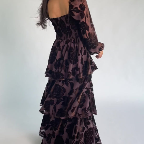 Alexandra Velvet Maxi Dress in Dark Brown with velvet florals, sweetheart neckline, long sleeves, smocked back, and flowing skirt.