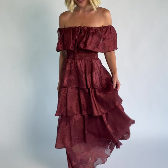 Carina Off Shoulder Maxi Dress in Marsala with ruffle neckline, smocked waist, and four-tiered chiffon skirt.