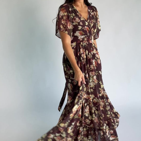Katherine Maxi Dress in Vintage Clove Floral with V-neckline, flutter sleeves, adjustable waist ties, and tiered skirt.