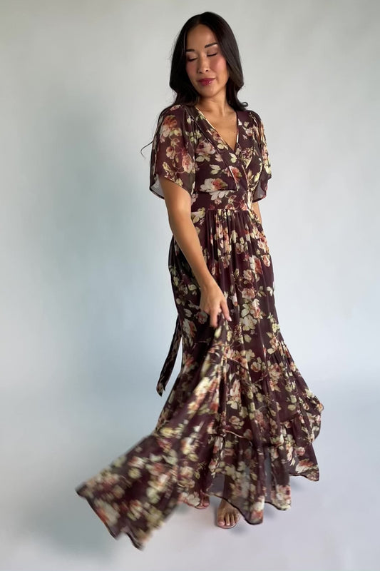 Katherine Maxi Dress in Vintage Clove Floral with V-neckline, flutter sleeves, adjustable waist ties, and tiered skirt.