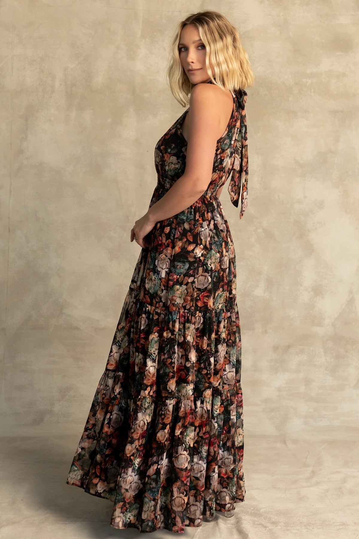 Pulitzer Maxi Dress in Black Multi Floral with halter neckline, smocked waist, tie-back detail, and tiered chiffon skirt.