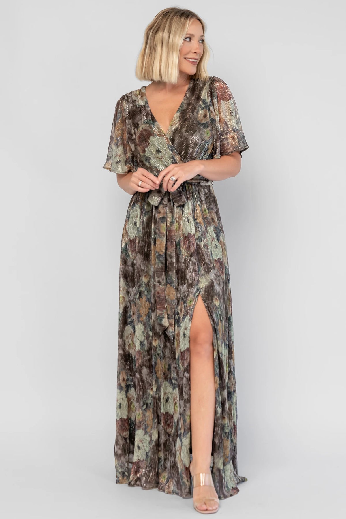 Rachel Maxi Dress in Green Multi with abstract floral details, a faux-wrap neckline, and semi-sheer overlay.