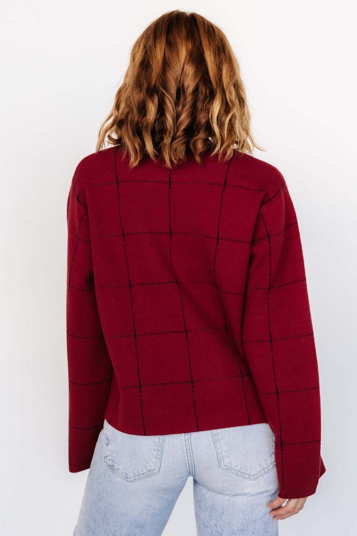 Styled outfit photo showing Remington Sweater paired with jeans; highlights relaxed boxy silhouette, reversible inner color, and easy-to-layer proportions.