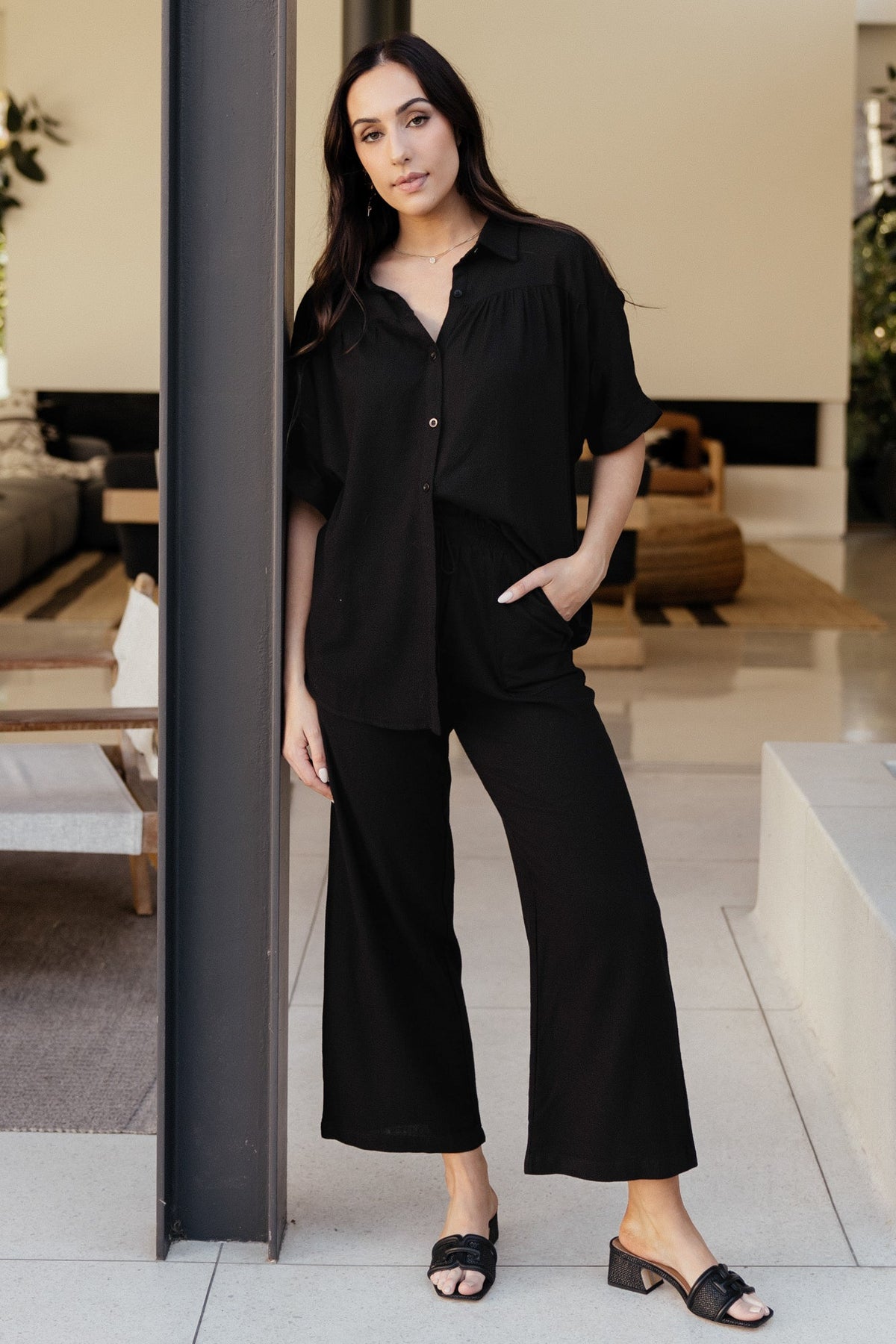 Close-up of button placket and lightweight linen-blend texture on the Romy Button Top, showing fabric texture and stitch.