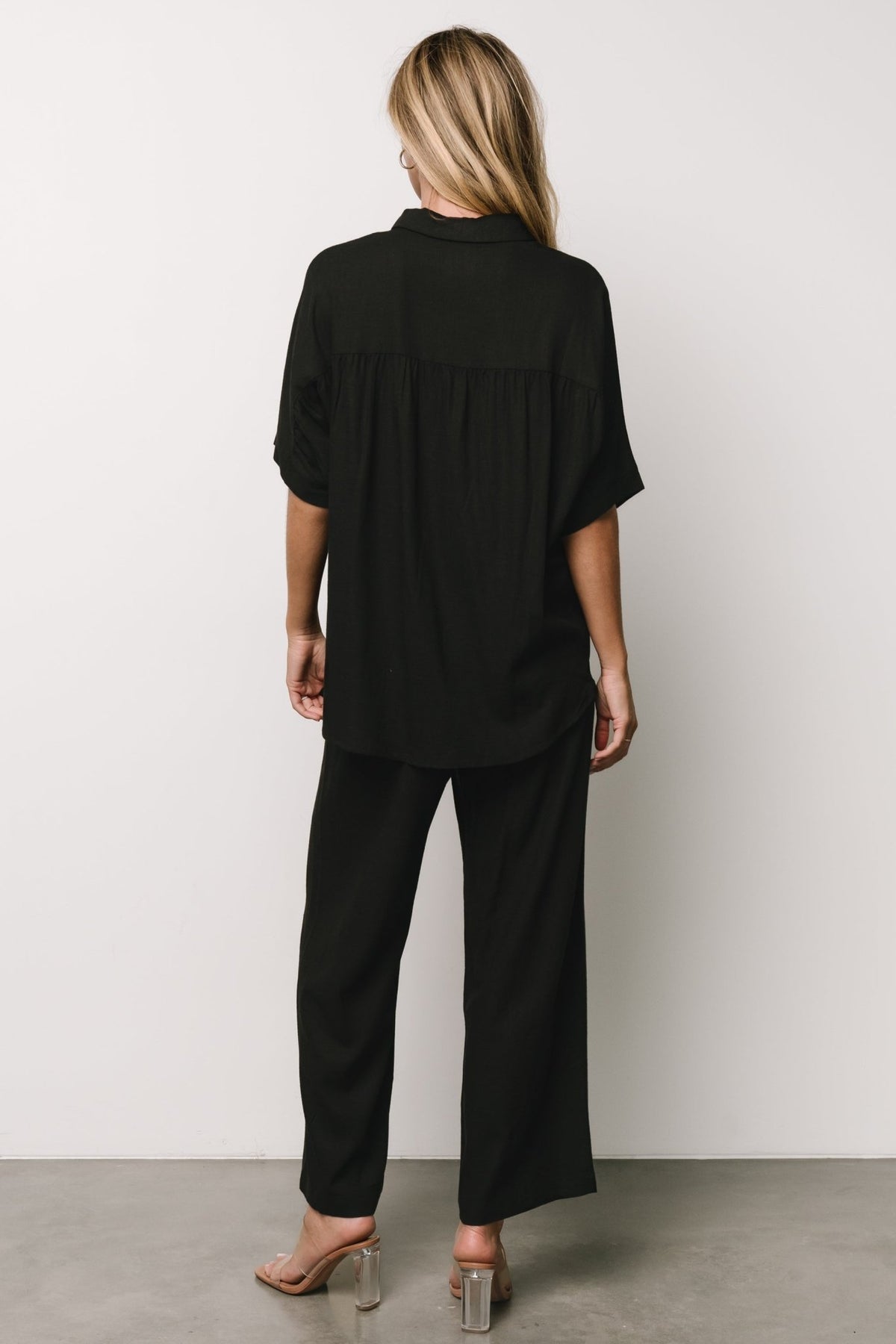 Detail image of Romy pants fabric and pocket area highlighting lightweight linen-blend texture and practical front pocket placement.
