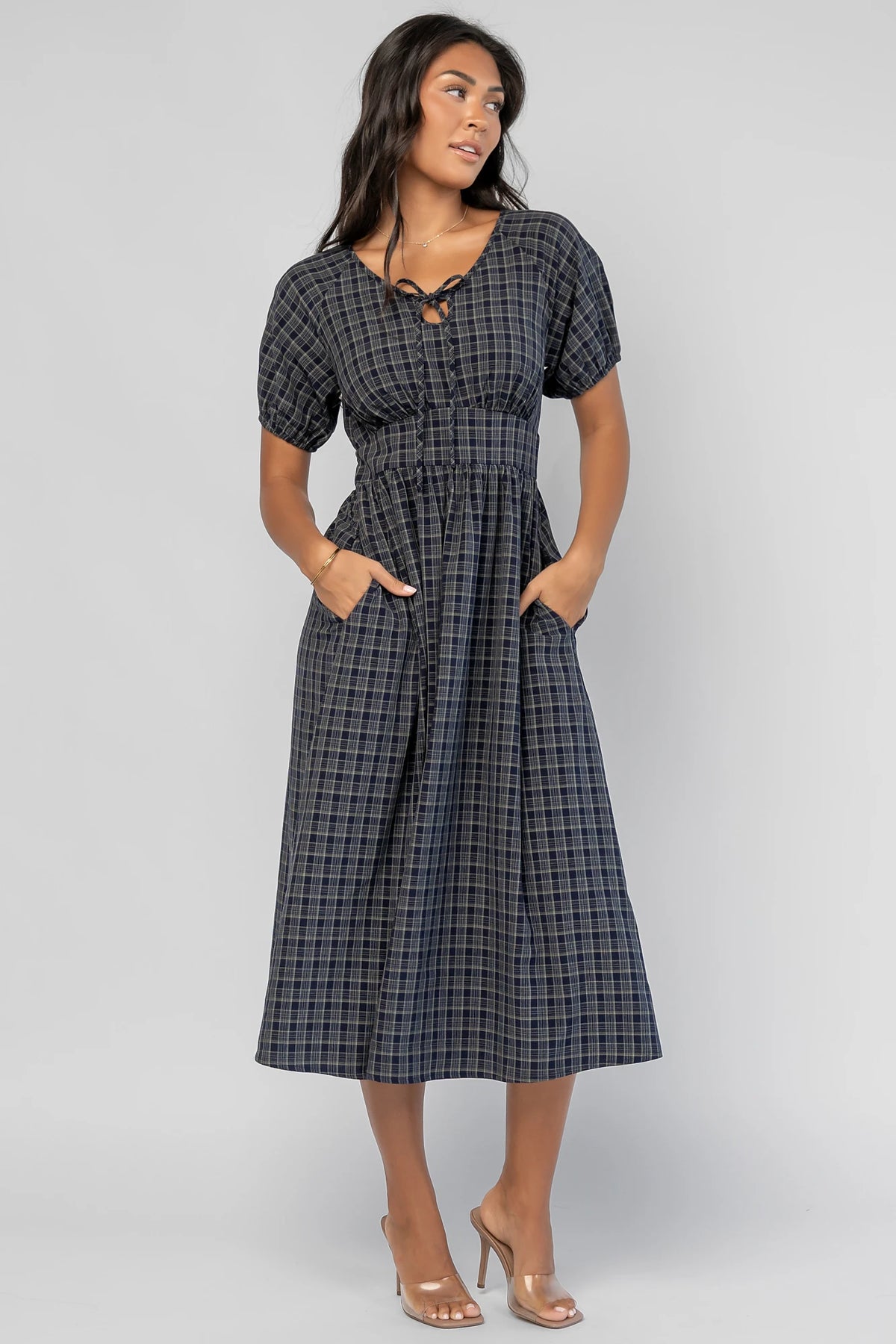 Rosalyn Midi Dress in Navy Plaid with V-neckline, adjustable bust tie, underbust panel, and midi skirt.
