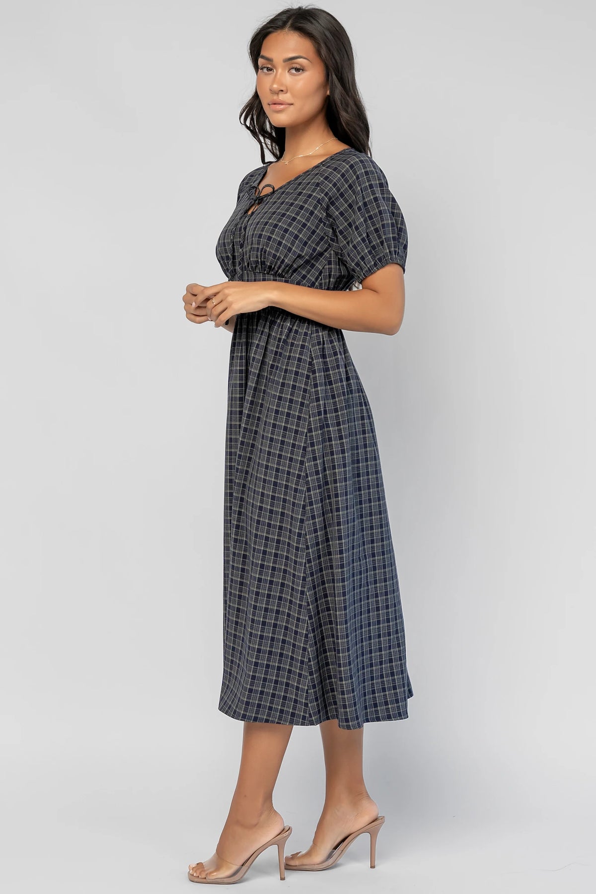 Rosalyn Midi Dress in Navy Plaid with V-neckline, adjustable bust tie, underbust panel, and midi skirt.