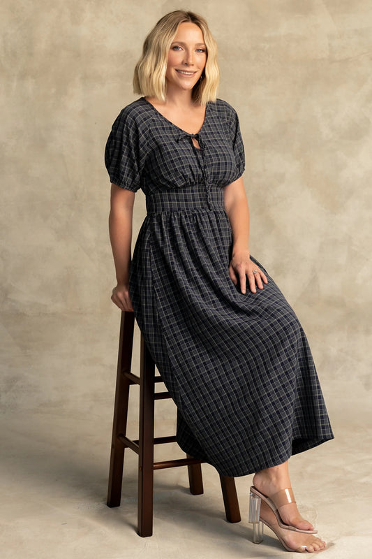 Rosalyn Midi Dress in Navy Plaid with V-neckline, adjustable bust tie, underbust panel, and midi skirt.