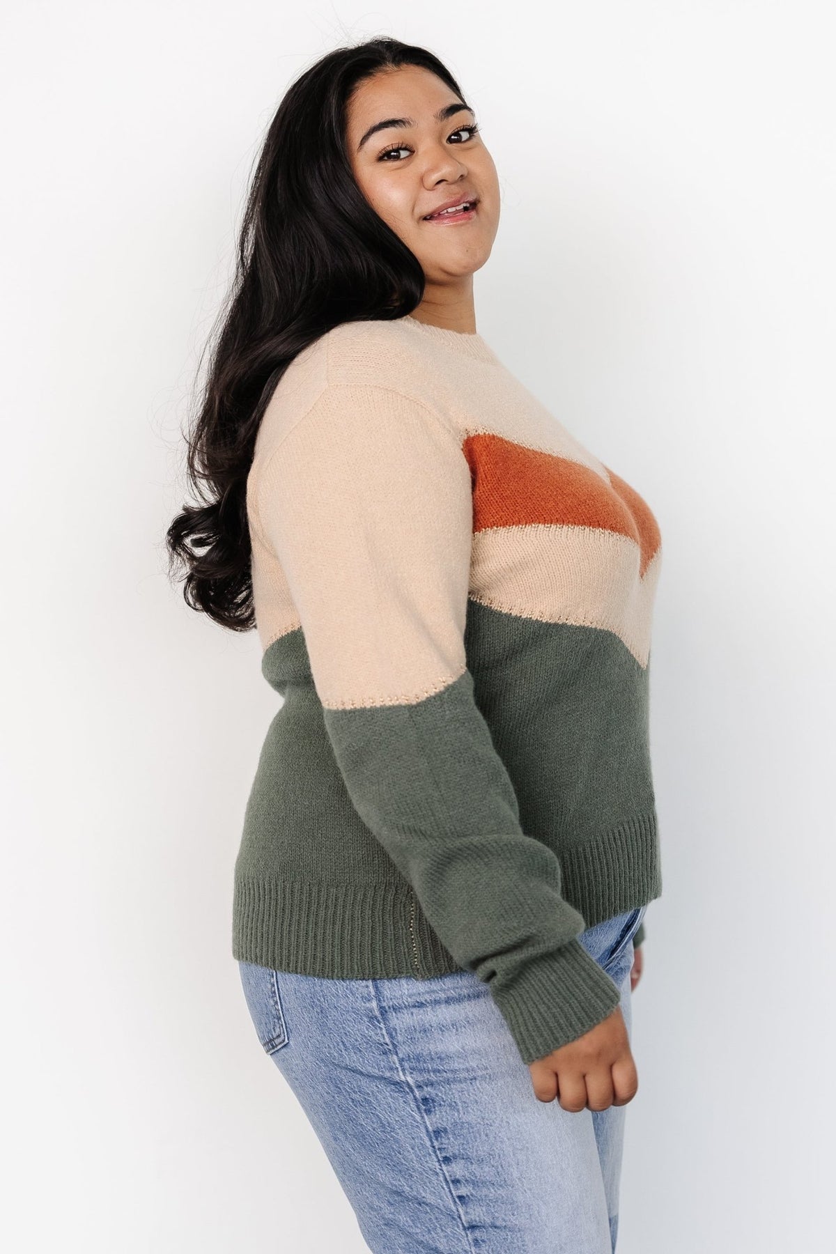 Styled outfit photo with Rowen sweater paired with denim, showing texture, fit and how the metallic thread catches light.