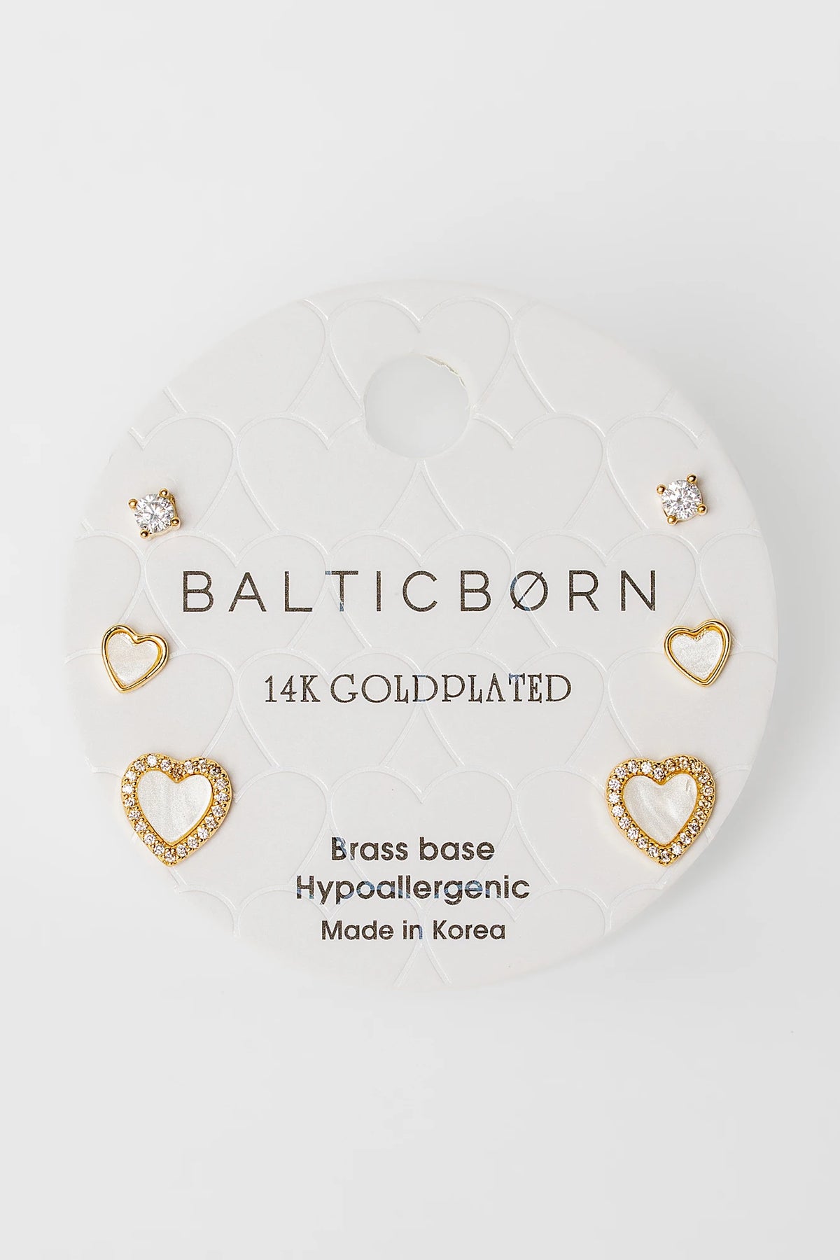 Roxanne Stud Earring Set in Gold with solitaire and heart-shaped stud designs.