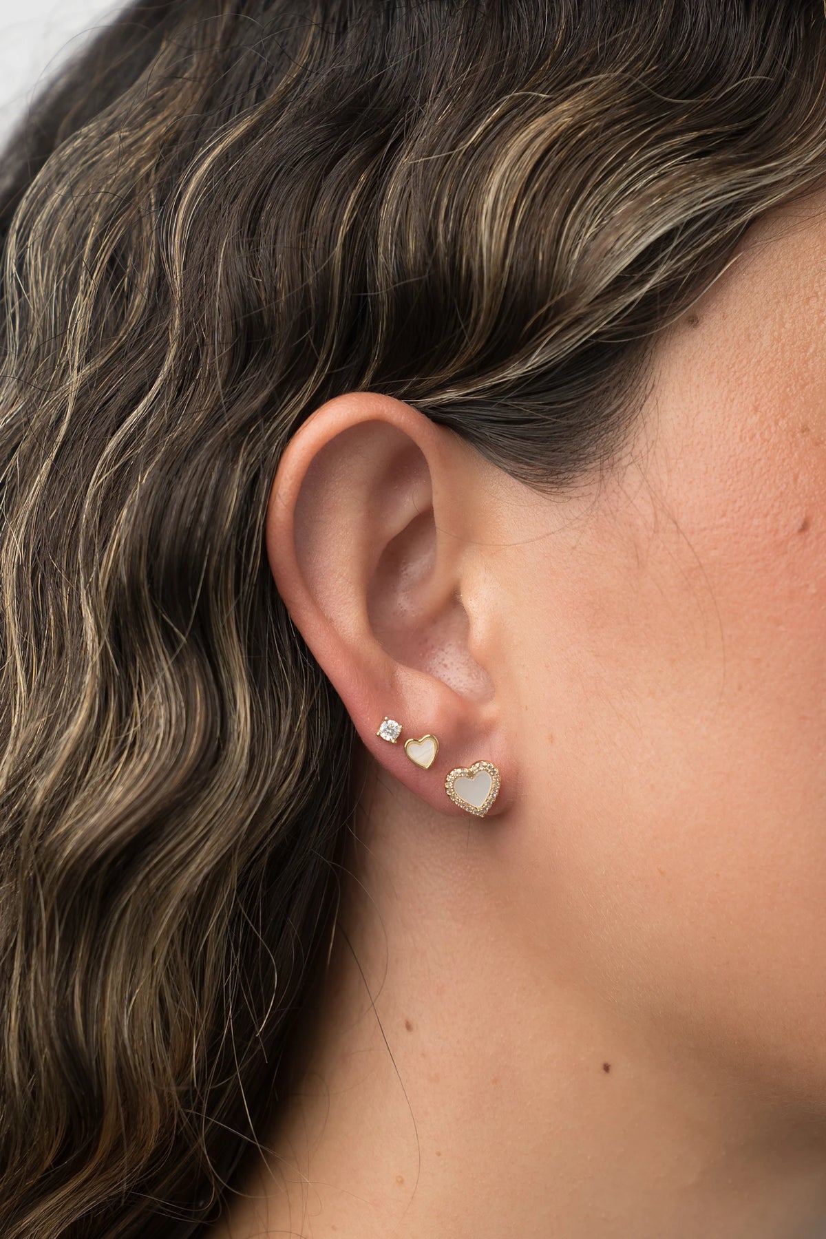 Roxanne Stud Earring Set in Gold with solitaire and heart-shaped stud designs.
