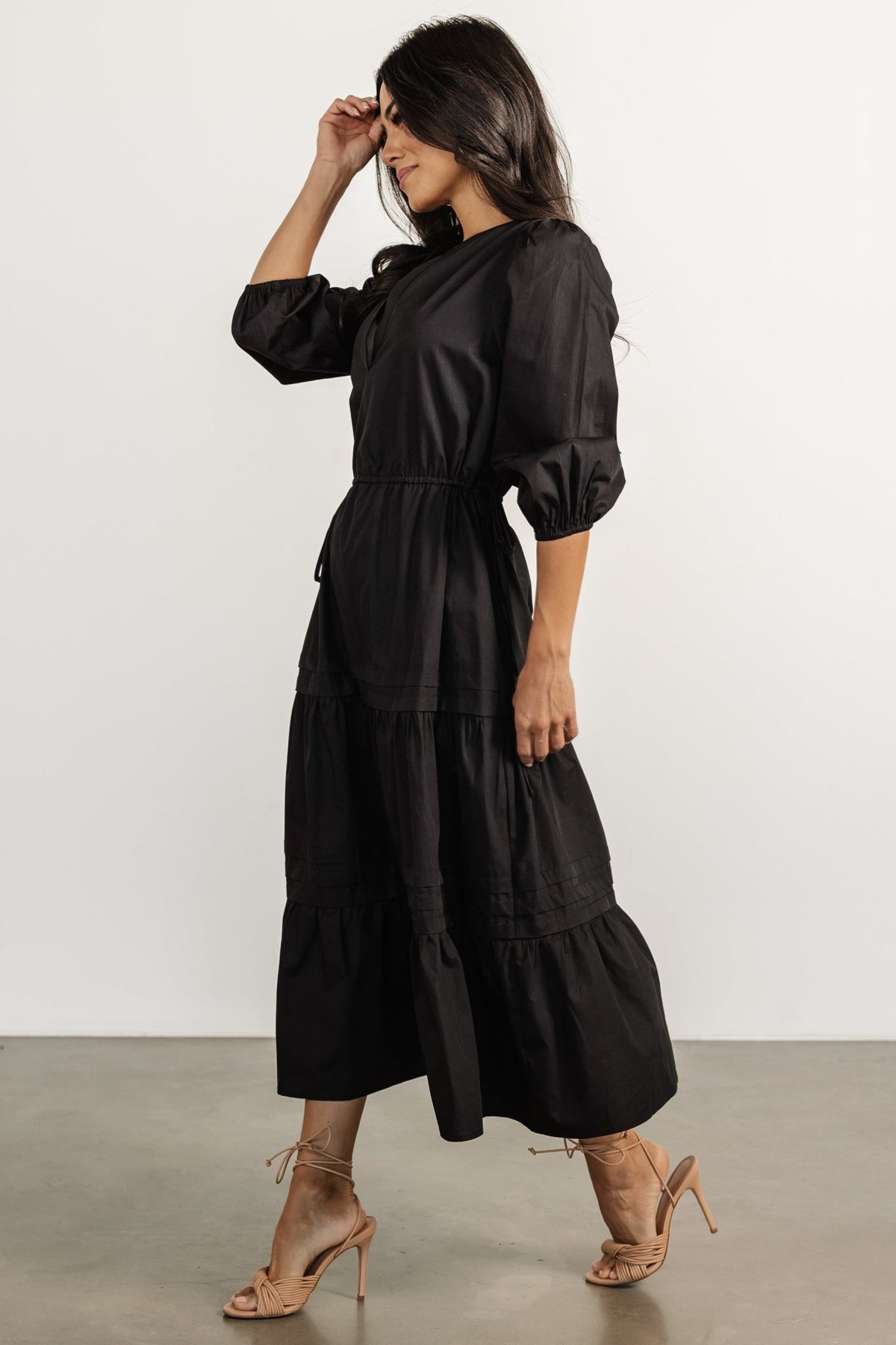 Back view of the Santa Fe Poplin Midi Dress in black showing clean, unlined construction and mid-length hem suitable for versatile styling from day to night.