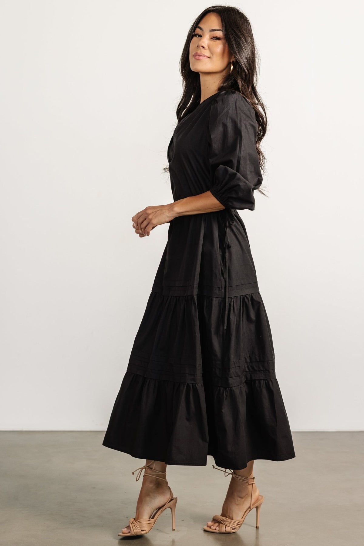 Close-up of the Santa Fe Poplin Midi Dress in black showing the poplin texture and elastic cuff detail on the 3/4 sleeve; fabric is 100% cotton and unlined.