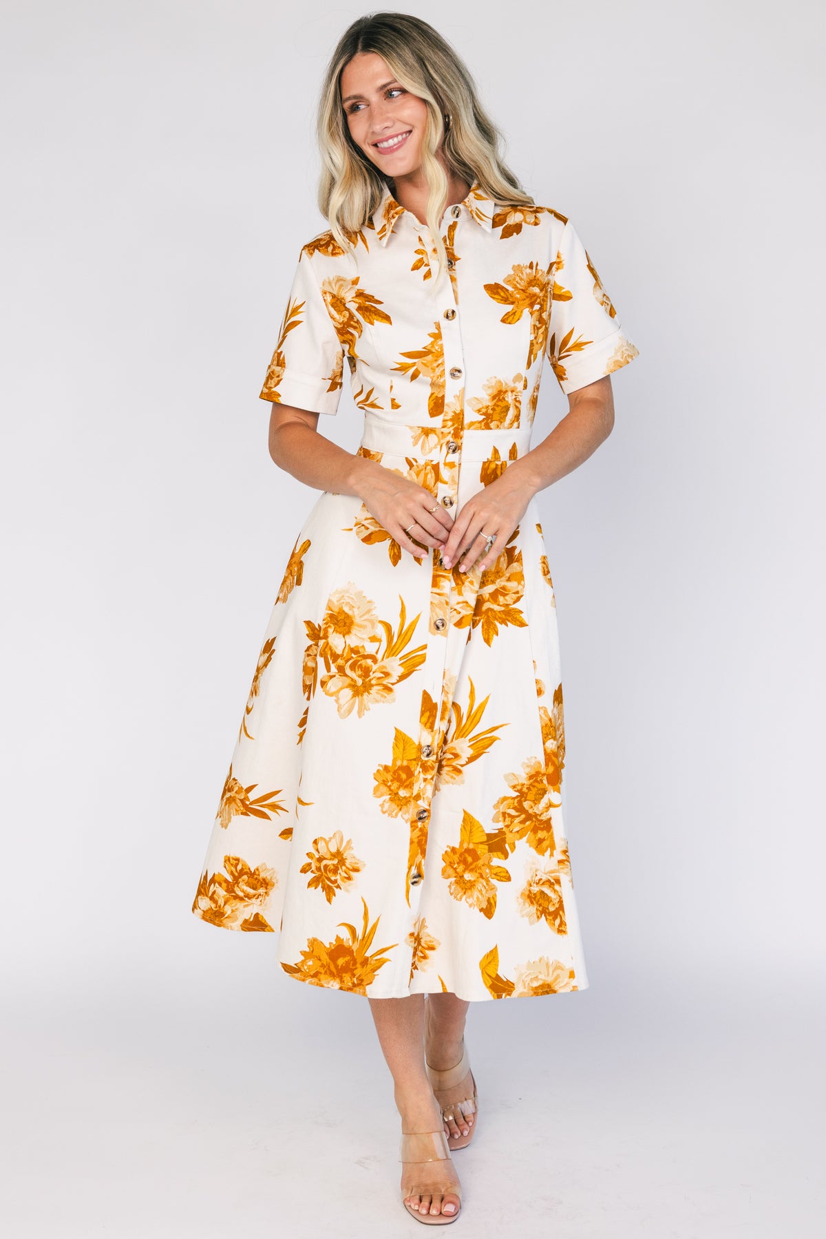 Selena Button Up Dress in Ivory + Golden Floral with collared neckline, button front, short sleeves, and fit-and-flare skirt.