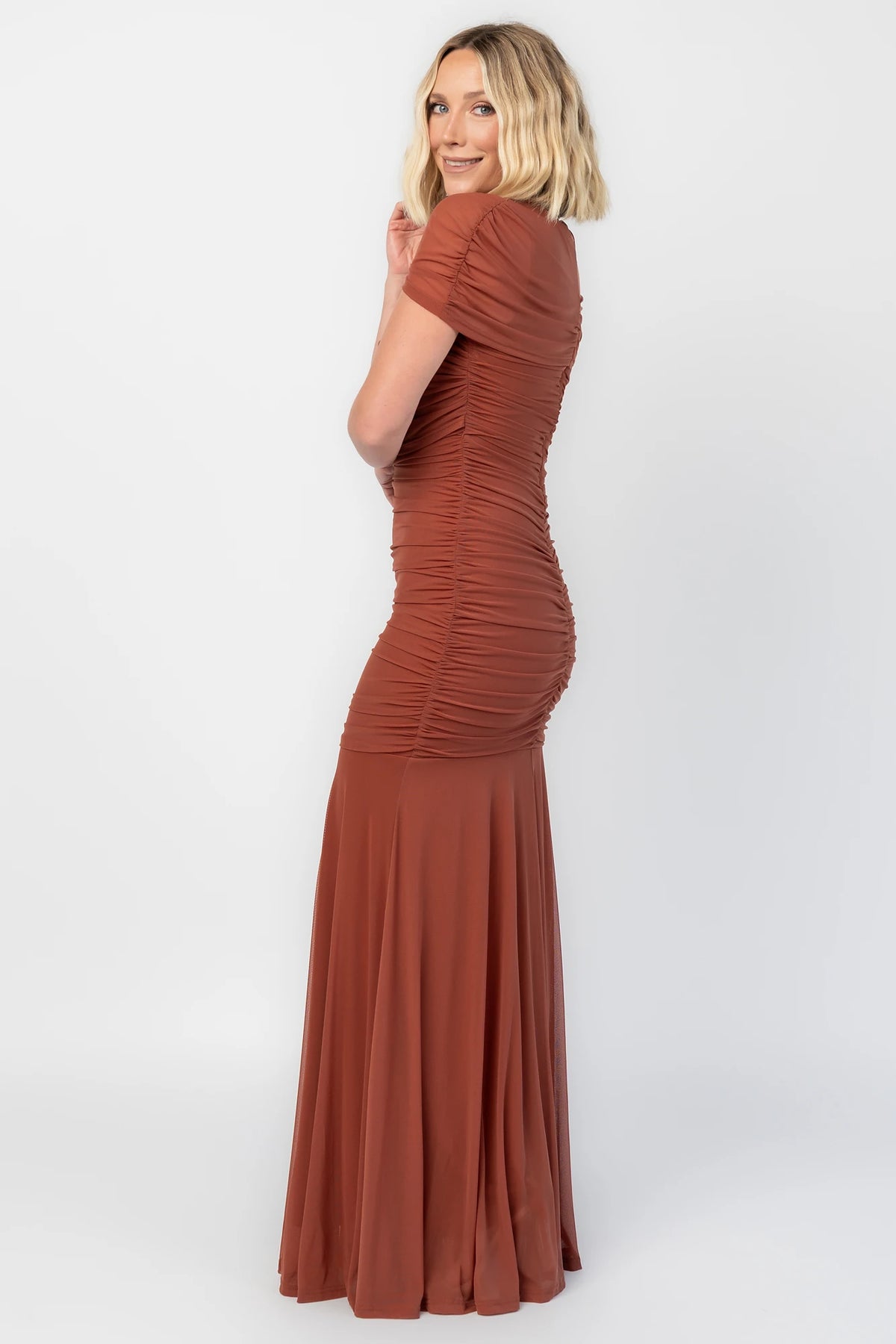 Serenade Maxi Dress in Cinnamon with an asymmetrical neckline, shoulder overlay, and a mermaid hem.