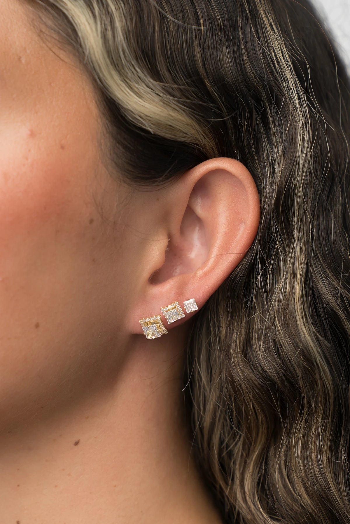 Shaylee Stud Earring Set in Gold with three stud pairs in solitaire and halo designs.