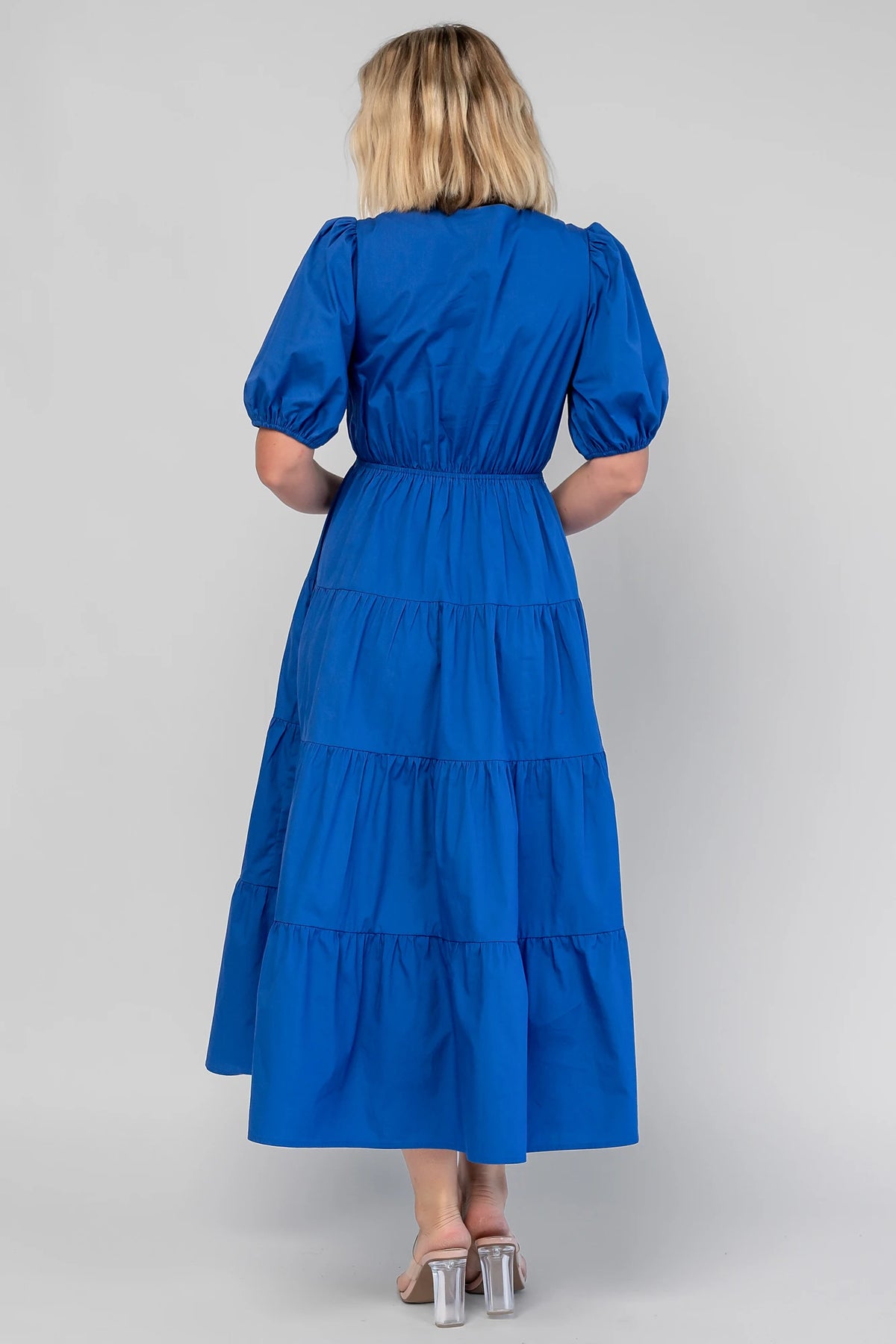 Sheila Tiered Midi Dress in Cobalt with V-neckline, front ties, puff sleeves, smocked empire waist, and tiered skirt.