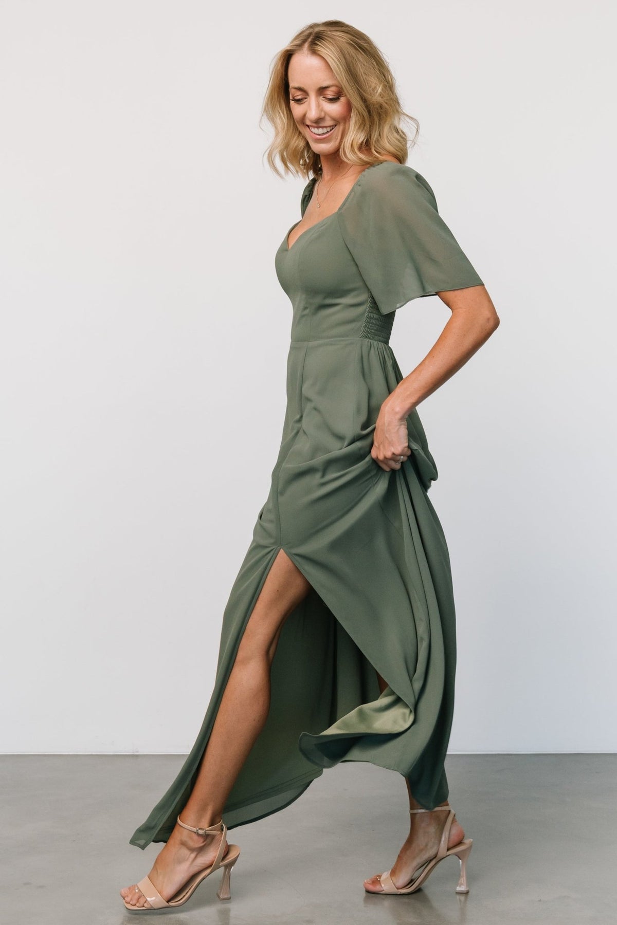 Back view of Sierra Sweetheart Maxi Dress in dark sage showing smocked back bodice and the lightweight chiffon overlay.