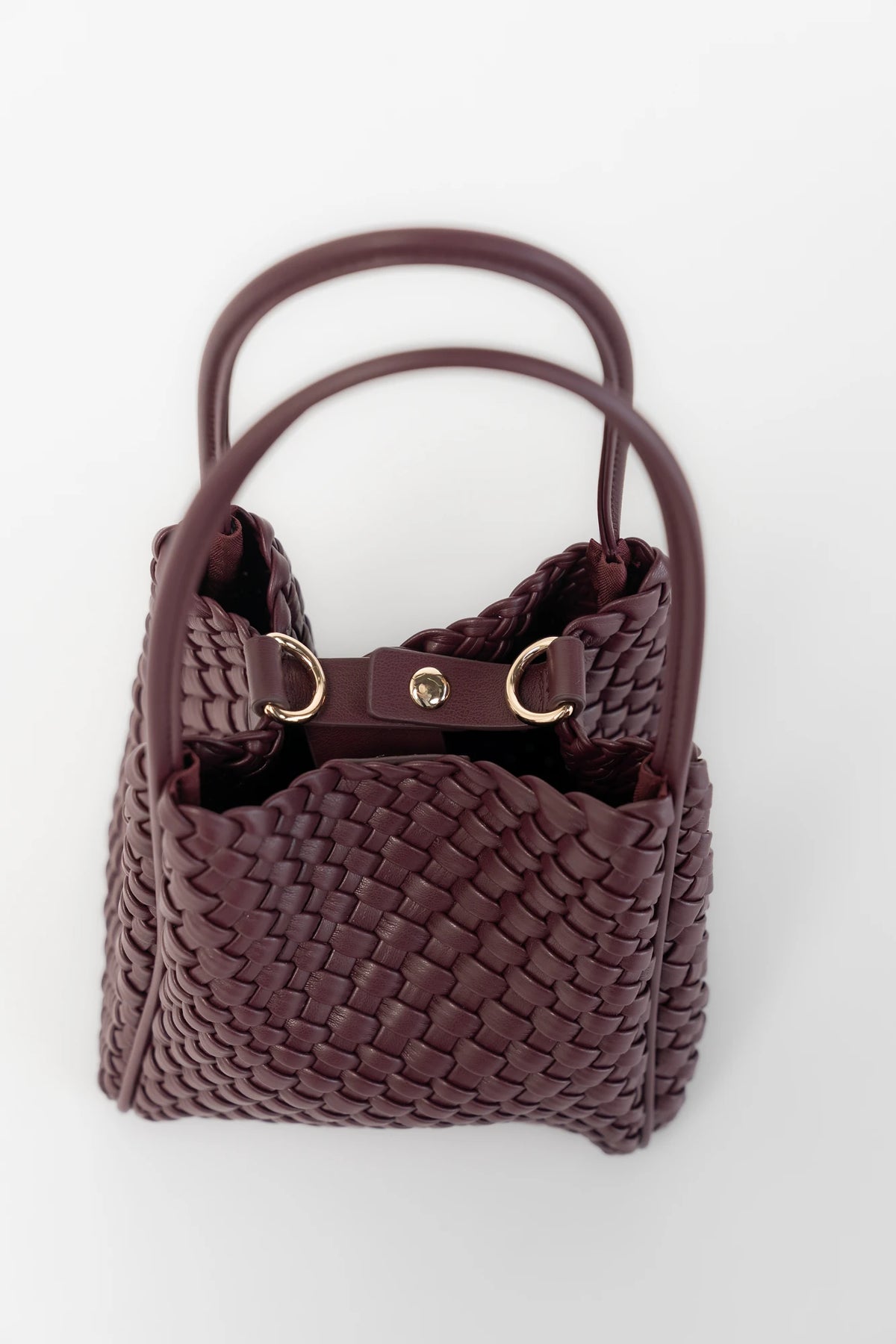 Simone Woven Tote Bag in Wine with removable shoulder straps, matching coin pouch, button closures, and convertible shape.