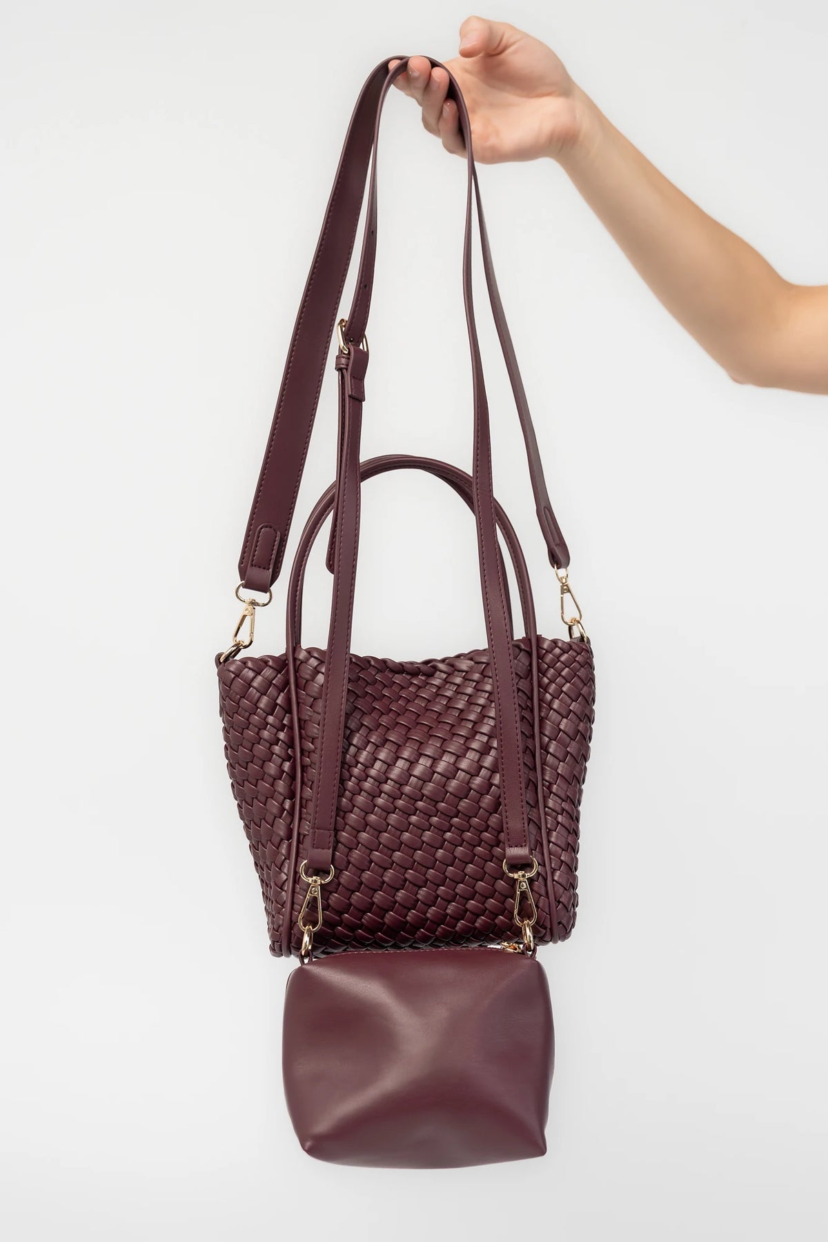 Simone Woven Tote Bag in Wine with removable shoulder straps, matching coin pouch, button closures, and convertible shape.