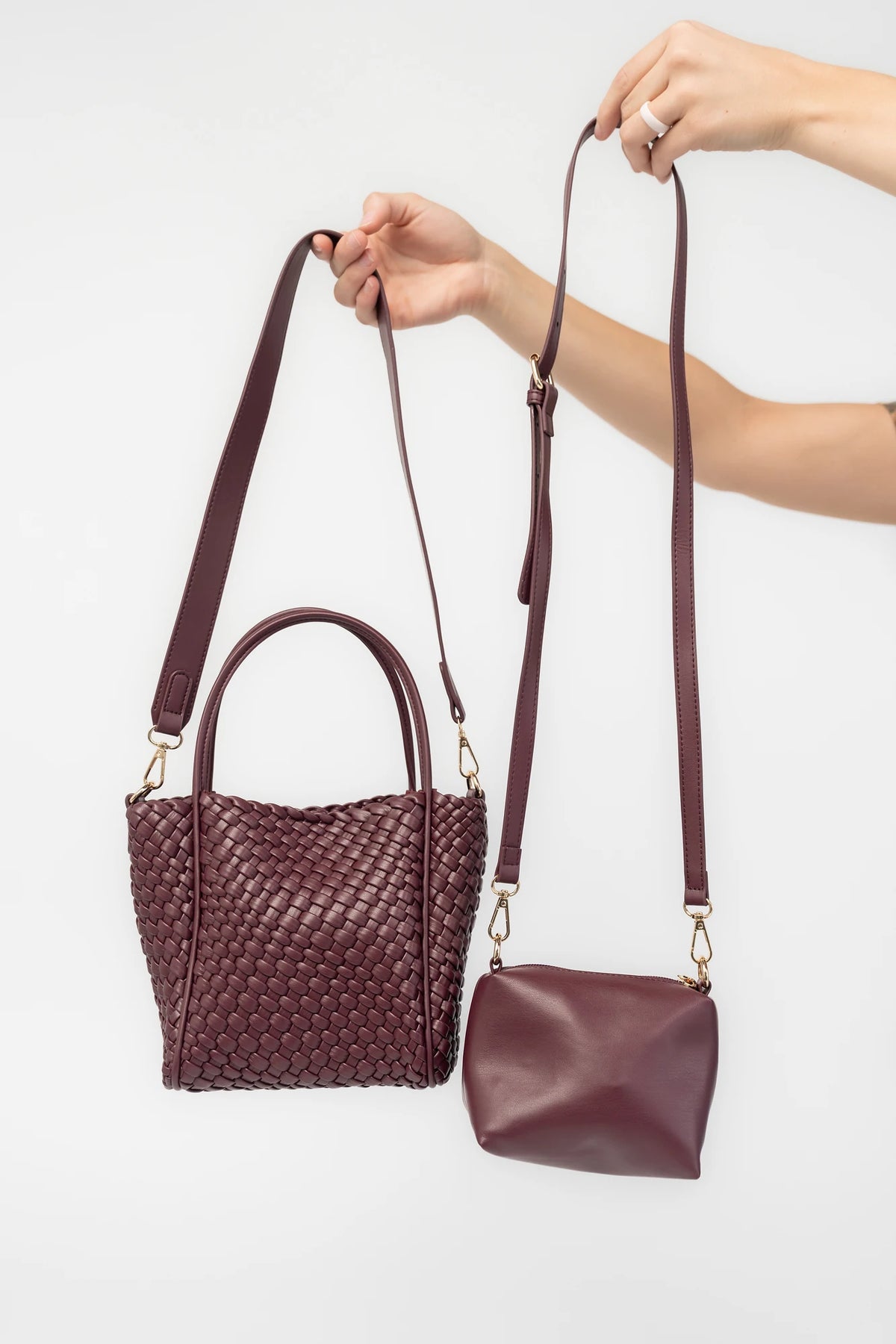 Simone Woven Tote Bag in Wine with removable shoulder straps, matching coin pouch, button closures, and convertible shape.