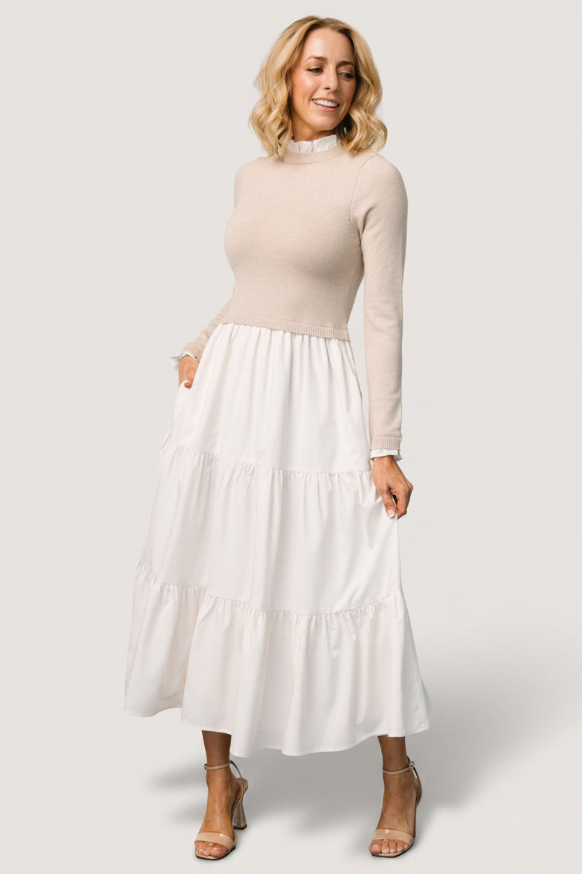 Studio photo of Sophie Sweater Dress in Natural displaying the lined skirt and tiered hem movement.