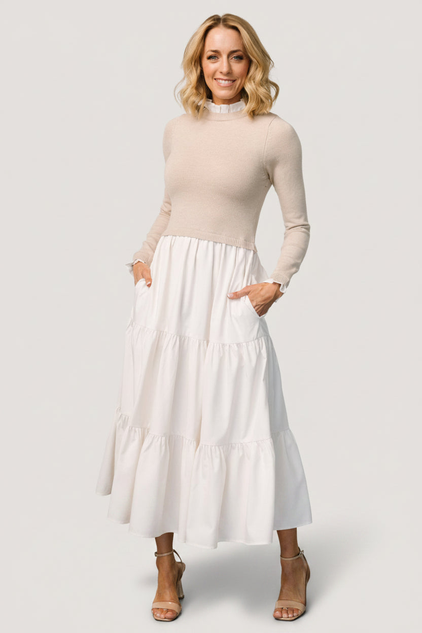 Model wearing Sophie Sweater Dress in Natural — three-tier maxi skirt and fully lined skirt shown in natural monochrome tones.