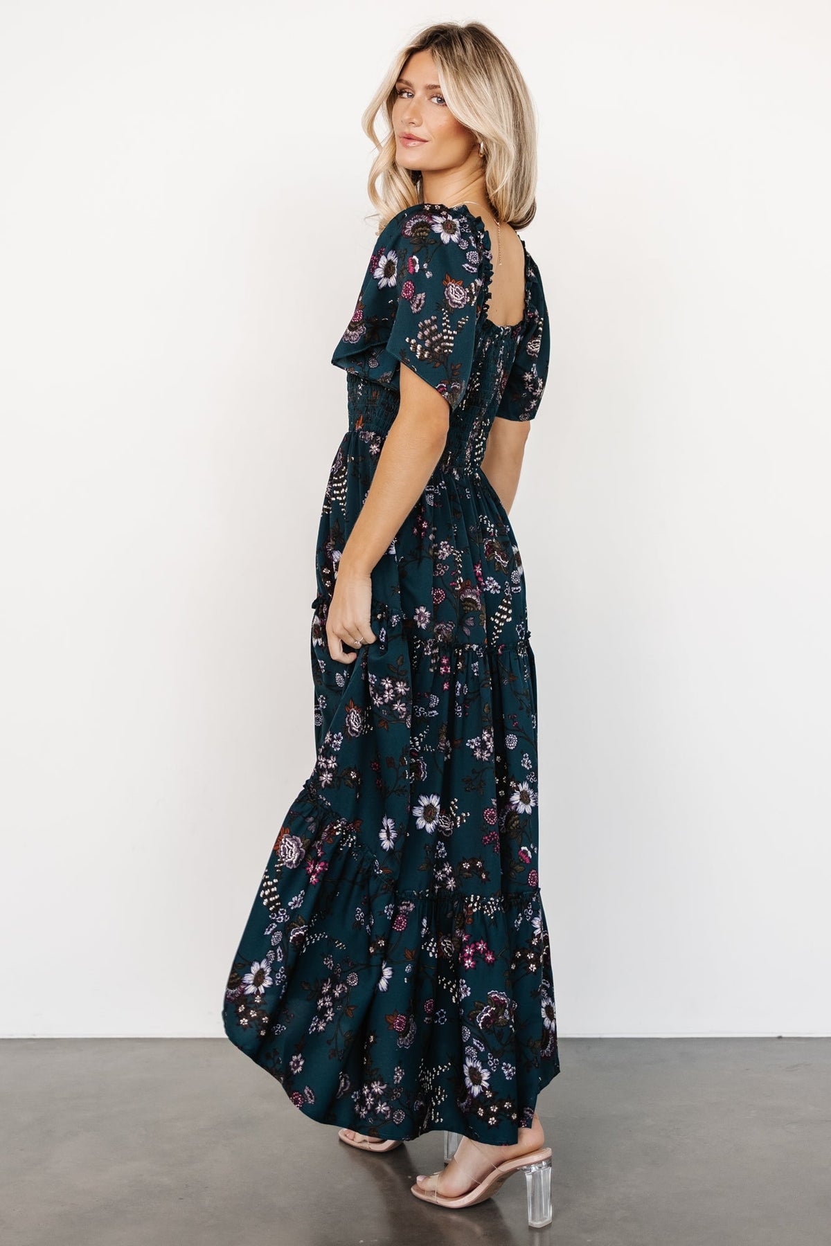 Back and side view of Southampton smocked maxi dress in jade blossom showing full skirt tiers and natural drape of lightweight fabric.