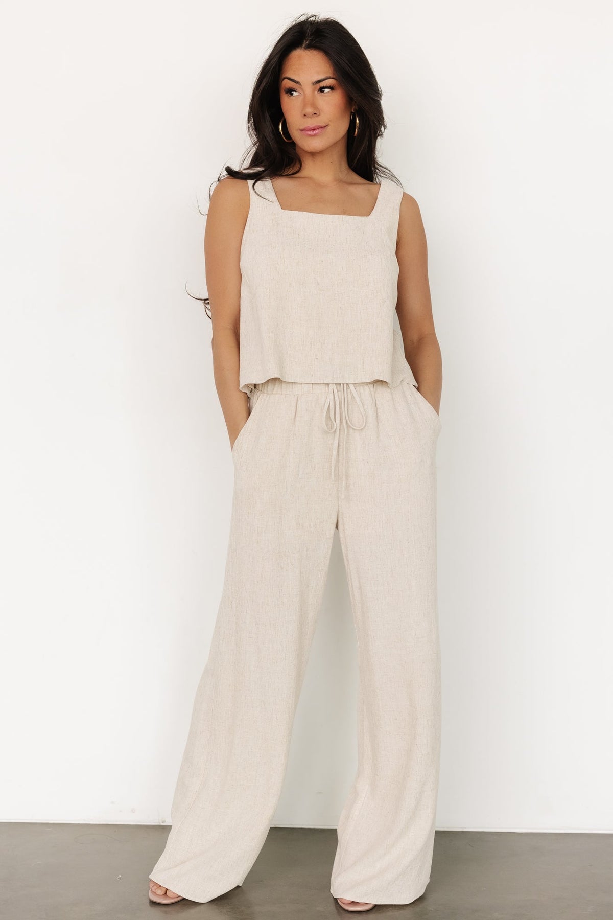 Close-up of tank showing square neckline, fabric seams at the bust, and soft heathered linen-rayon texture in natural color.