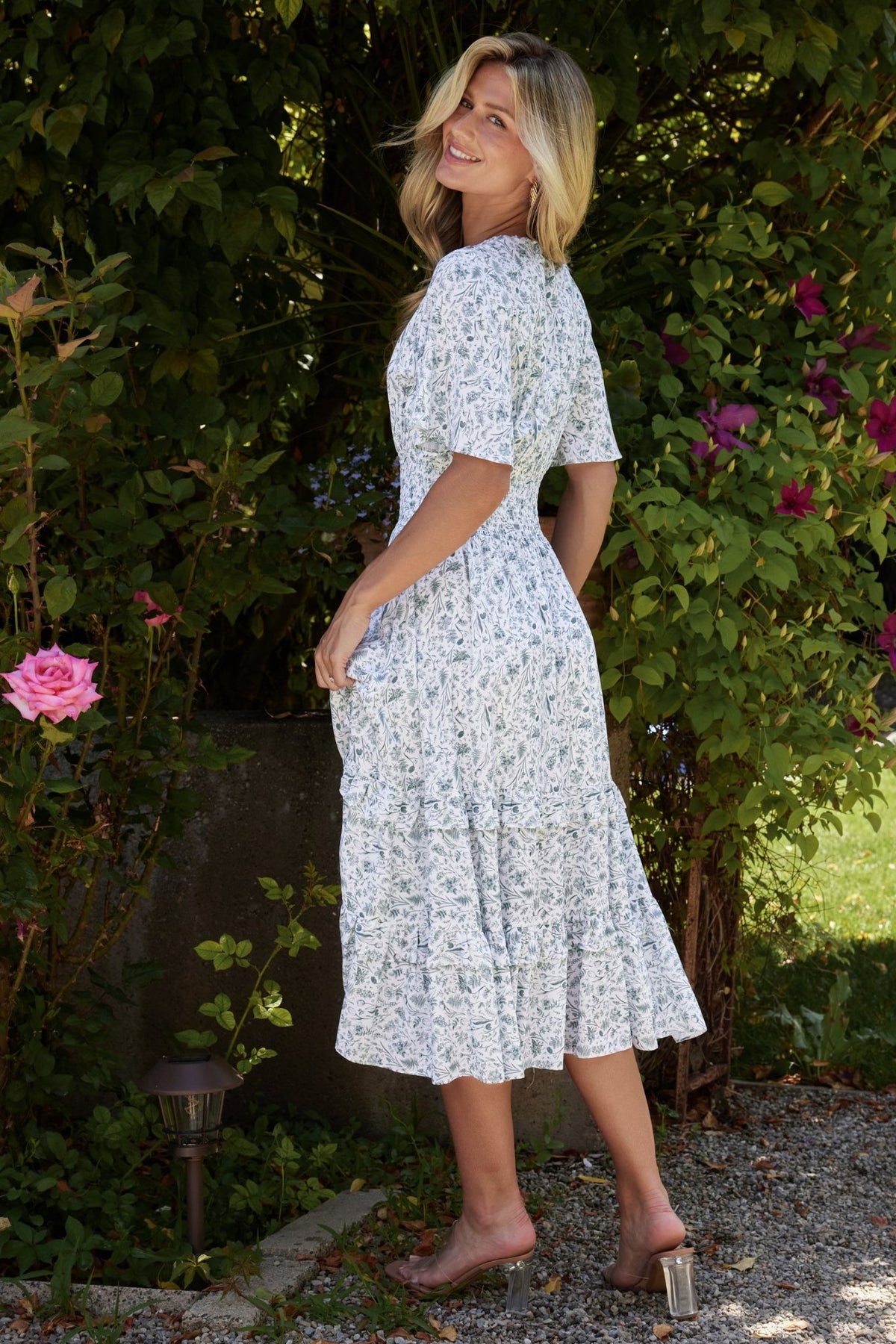 Hem and skirt movement close-up of the boho midi dress showing drape and subtle ruffle at the hemline.