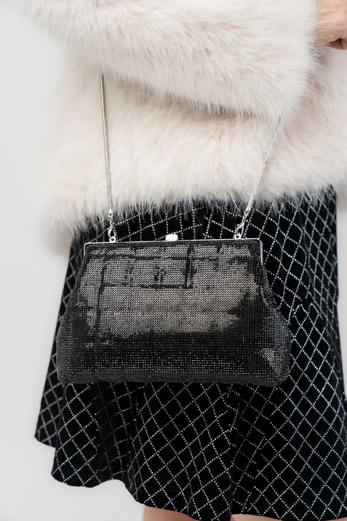Starlight Evening Clutch Bag with black rhinestones, structured silhouette, clasp closure, and detachable chain strap.