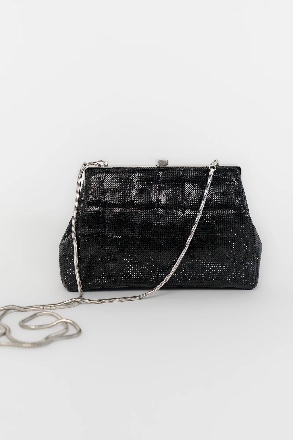 Starlight Evening Clutch Bag with black rhinestones, structured silhouette, clasp closure, and detachable chain strap.