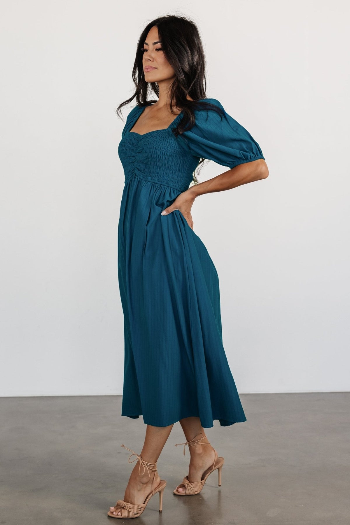 Close-up detail of the smocked bodice and stretchy sweetheart neckline of the Mediterranean Blue Stefania Midi Dress, highlighting the pin-striped chiffon.