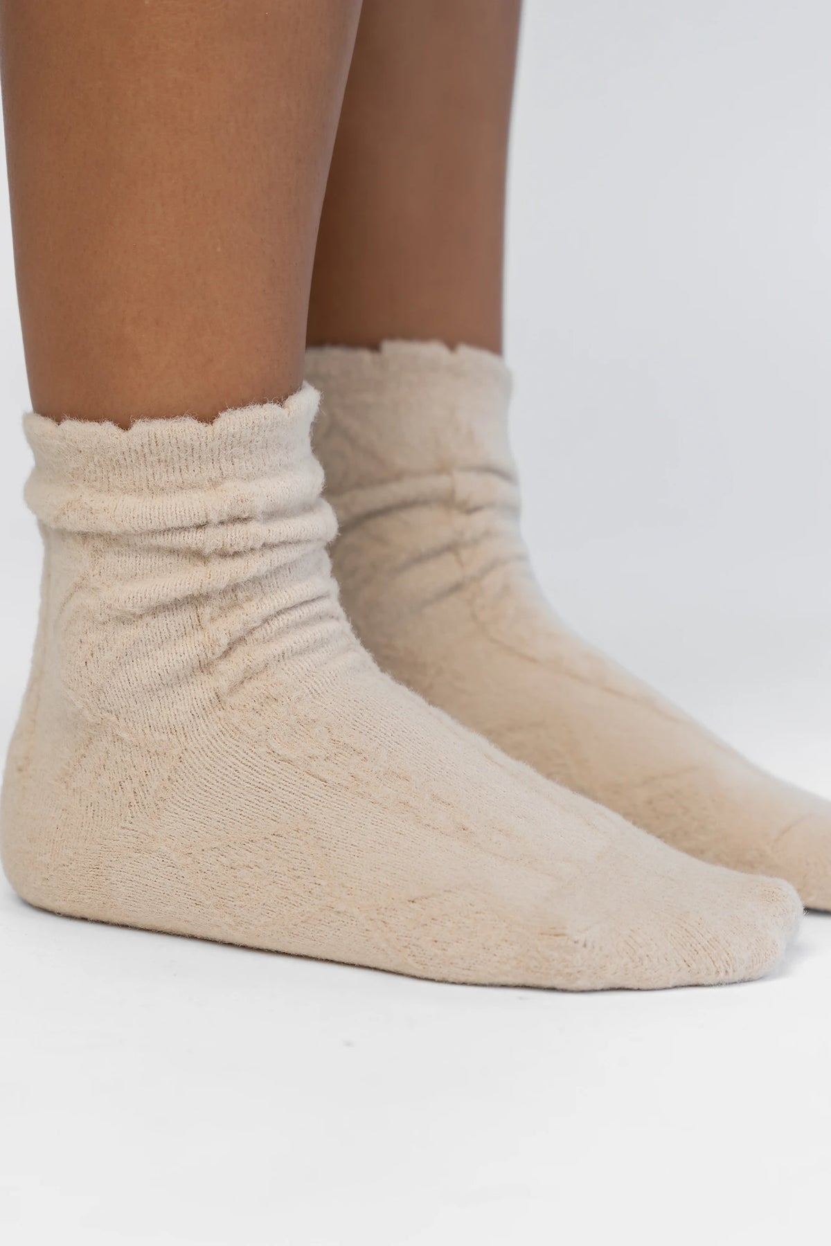 Sterling Cozy Cable Knit Socks in Oatmeal with a soft cable knit design and a ribbed cuff.