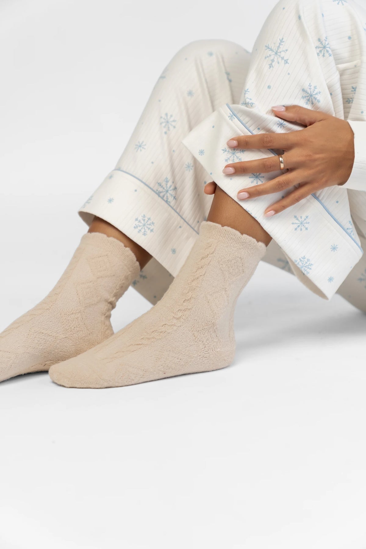 Sterling Cozy Cable Knit Socks in Oatmeal with a soft cable knit design and a ribbed cuff.