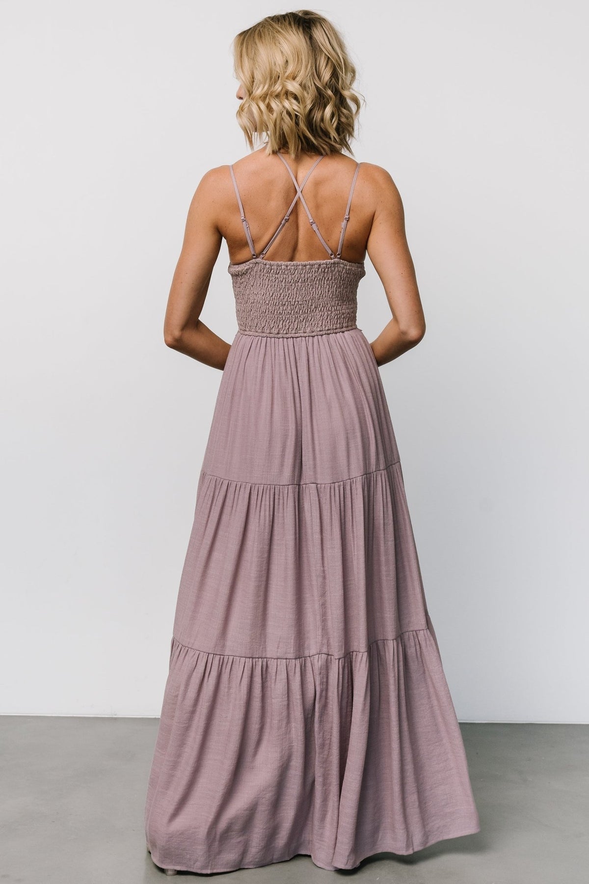 Styled look with accessories: dusty mauve maxi dress paired with sandals, demonstrating versatility for daytime and evening wear.