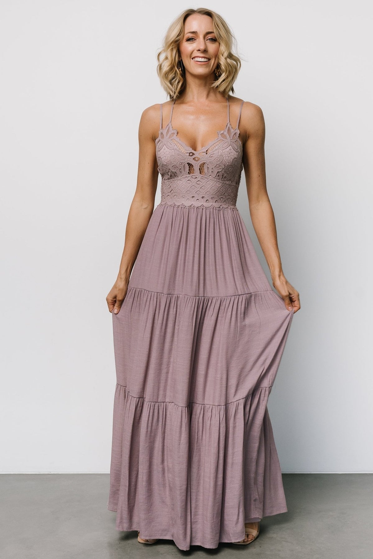 Close-up of lace bodice in dusty mauve showing scalloped edge, intricate lace pattern, and the panel under bust for shaping.